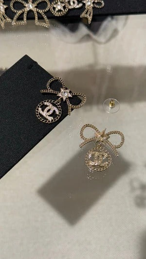 Chanel Black Letter Earrings With White Ribbon And Bow