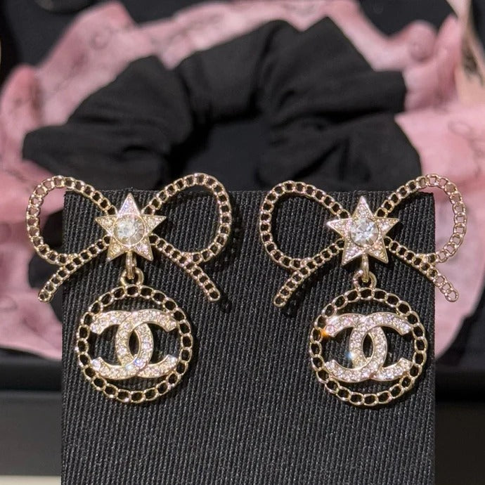Chanel Black Letter Earrings With White Ribbon And Bow
