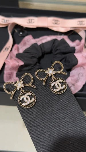 Chanel Black Letter Earrings With White Ribbon And Bow